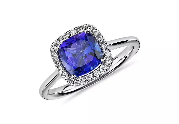 A square tanzanite engagement ring with diamond pave halo